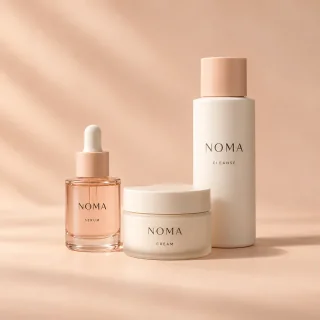 Fictional Noma serum, cream and cleanser in peach and ivory packaging